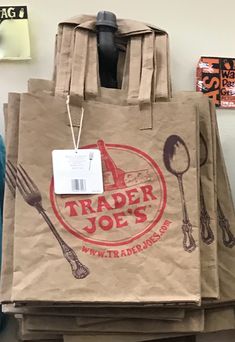 a brown paper bag with the words trader joe's and spoons on it