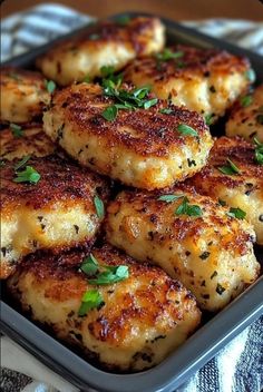 some food is sitting in a pan on a tablecloth and it looks like they have been cooked