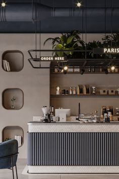 the interior of a coffee shop with plants on the counter and shelves above it,