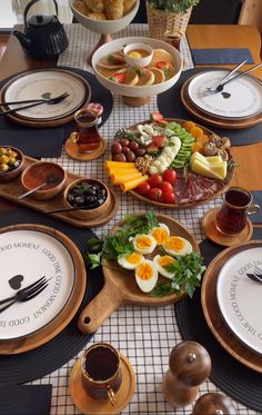 the table is set with many different types of food