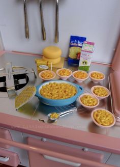 there are many bowls and containers on the counter with food in them, including cereal