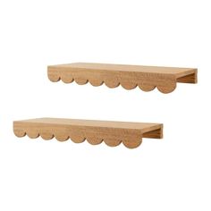 two wooden shelves with scalloped edges