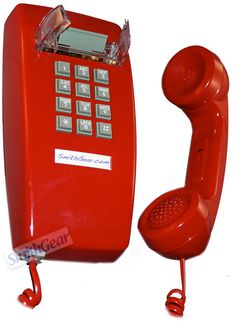 an old fashioned red phone is on display