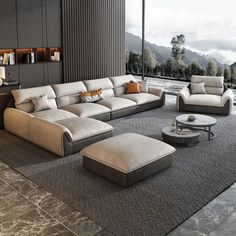 a modern living room with large windows overlooking the mountains