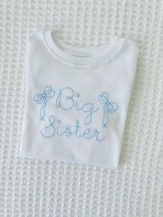 Hand embroidered Big Sister T-shirt. This high quality, minimalistic design is perfect for your little toddler for pictures, baby announcements, and more! Big Sister Shirts, Hand Embroidered Shirt, Big Sister Announcement, Big Sister T Shirt, Sister Tshirts, Baby Announcements, Big Sister Shirt, Sister Shirts, Minimalistic Design