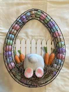 an easter decoration made out of fake eggs and carrots