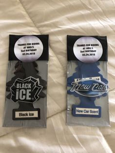 two new york black ice key tags on a bed