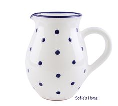 a white and blue polka dot coffee mug on a white background with the words softie's home written below it