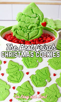 Grinch cookies on the counter and in a bowl of red hots. Snowball Grinch Cookies, Grinch Cutout Cookies, Grinch Birthday Party Food Ideas, Christmas Grinch Desserts, Diy Grinch Cake, Grinch Themed Food Ideas, Grinch Christmas Cookies Decorated, The Grinch Food Ideas, Movie Snacks For Kids