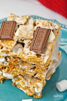 some kind of dessert with marshmallows and chocolate bars on it's top