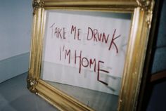 a framed sign that says take me down i'm home in red writing on it