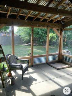 an empty patio with a bench and chairs