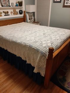 the bed is made and ready for someone to use it as a nightstand or night stand