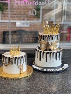 two decorated cakes sitting on top of a counter