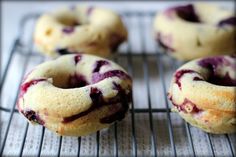 blueberry donuts cooling on a wire rack