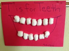 a red sign with marshmallows on it that says, it's for teeth