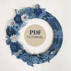 paper flowers arranged in a circular frame with the word pdf on it's side