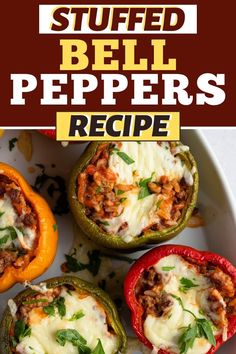 stuffed bell peppers with cheese and herbs in them on a white platter next to an orange pepper