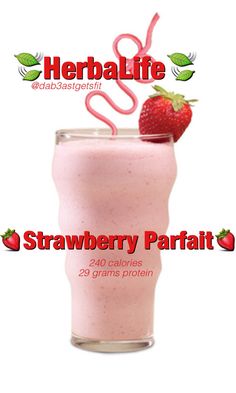 the strawberry parfait smoothie is in a glass with strawberries on top