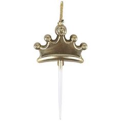 a gold crown on a white stick with a toothpick in the middle that is attached to it