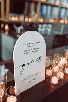 a table with candles and signs on it