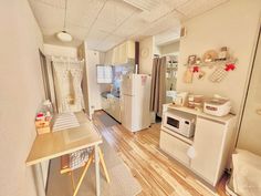 the kitchen is clean and ready to be used as a dining room or living room