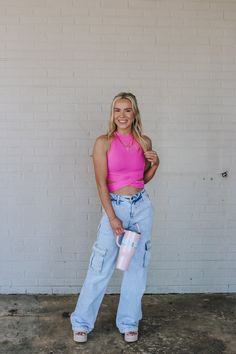 Unleash your playful side with the Causing Trouble Pink Crop Tank! This vibrant pink tank top will add a pop of color to any outfit, while the cropped style adds a touch of sass. Perfect for a day out with friends or a night out on the town. Get ready to turn heads and cause some trouble in this must-have tank! Casual Pink Crop Top For Day Out, Trendy Pink Crop Top For Day Out, Pink Cropped Tank Top For Workout, Trendy Pink Crop Top For Workout, Casual Spring Halter Top For Workout, Casual Spring Workout Halter Top, Pink Sleeveless Crop Top For Day Out, Cropped Pink Tank Top For Workout, Casual Pink Halter Top For Spring