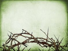 a crown of thorns with the word jesus on it's side in front of a grungy background