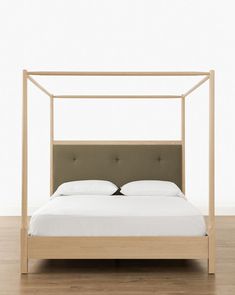 a bed that is sitting on top of a hard wood floor