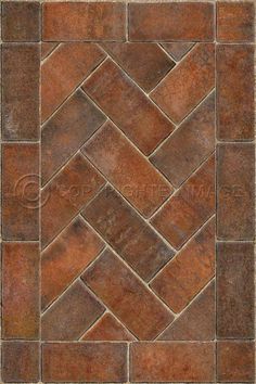 an old brick floor with different colors and patterns on the tile, as well as a pattern