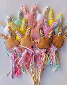 a bunch of bunny ears on top of some toothpicks with sequins