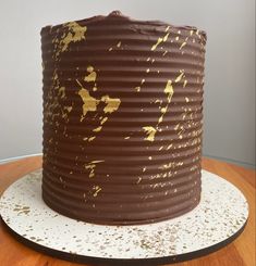 a chocolate cake sitting on top of a wooden table