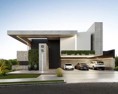 two cars parked in front of a modern house