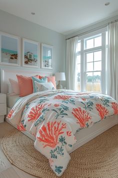 a bedroom with a large bed covered in colorful comforters and pillows, along with pictures on the wall