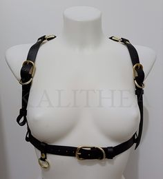 This harness is made of caoutchouc , a vegan friendly material. For all those who would like a harness but don't want a leather one, this is the right choice.  All parts are hand cut and assembled by me.  - Buckles for easy fastening and regulation of the length of the straps.  - It comes in various sizes, so please measure yourself before ordering.  - On the back is a decadent detail with rivets and a ring.  - This harness is simple but striking, you can wear it on a velvet goth dress, a grunge Goth Harness, Leather Harness Women, Harness Women, Harness Fashion, Grunge Shirt, Gothic Grunge, Goth Dress, Leather Harness, Grunge Goth