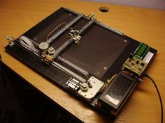 an open laptop computer sitting on top of a wooden desk