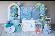 an ocean themed birthday party with balloons and decorations