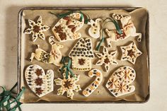 an assortment of decorated cookies on a baking sheet