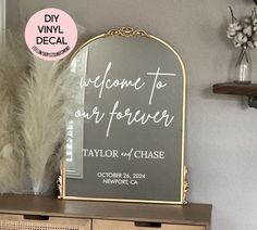 a mirror sitting on top of a dresser next to a vase and white pamolite