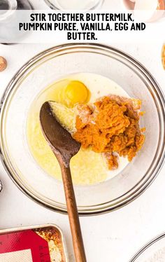 the ingredients to make buttered eggs in a glass bowl