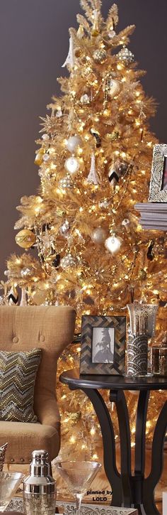 a living room with a christmas tree in the background