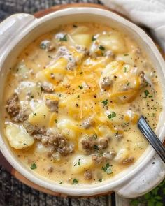 a bowl of soup with meat and cheese