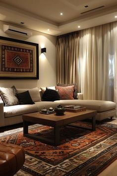 a living room filled with furniture and a large rug on top of a wooden floor