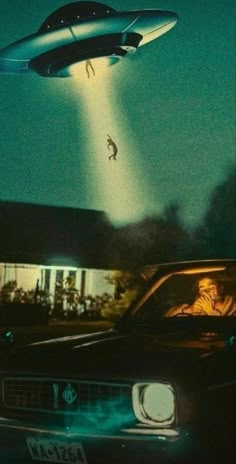 an image of a man flying in the sky above a car