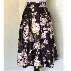 Brand New. Never Worn. Perfect Condition. Beautiful Floral Midi Skirt From Chicing. Size Small. Elastic Waist 13 Before Stretched. Length 25. Zipper On The Side. Black Floral Print Party Skirt, Black A-line Skirt For Spring, Floral Midi Skirt, Women Skirts Midi, On The Side, Midi Skirt, Elastic Waist, Womens Skirt, Elastic