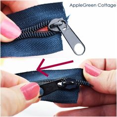 an open zipper being used to zip a pair of jeans