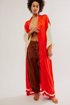 Featuring a colorful and statement design on the back, this maxi kimono is featuring in a silky fabric and shapeless silhouette. * Wide sleeves * Maxi length * Arm vents | Moon Dance Maxi Kimono by Free People in Red Red Kimono With Kimono Sleeves For Festival, Red Loose Fit Kimono, Oversized Red Kimono, Red Silk Kaftan For Festival, Silk Maxi Length Kimono, Red Open Front Kimono For Spring, Red Silk Long Kaftan, Oversized Silk Kimono, Bohemian Red Silk Kimono