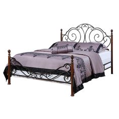 a metal bed frame with purple sheets and black trimmings on the headboard