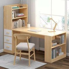 a computer desk with a chair and bookshelf in front of a large window