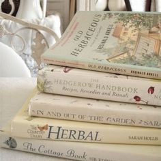 a stack of books sitting on top of a table